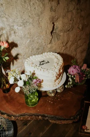 Piped heart wedding cake disco ball table styling