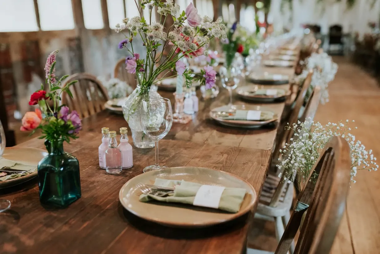 Rustic wedding table setting pink shots wildflowers