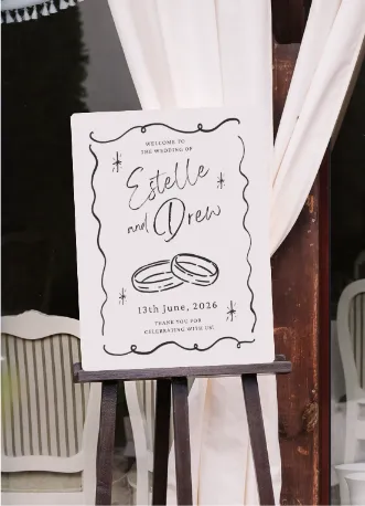 Whimsical illustrated wedding welcome sign easel