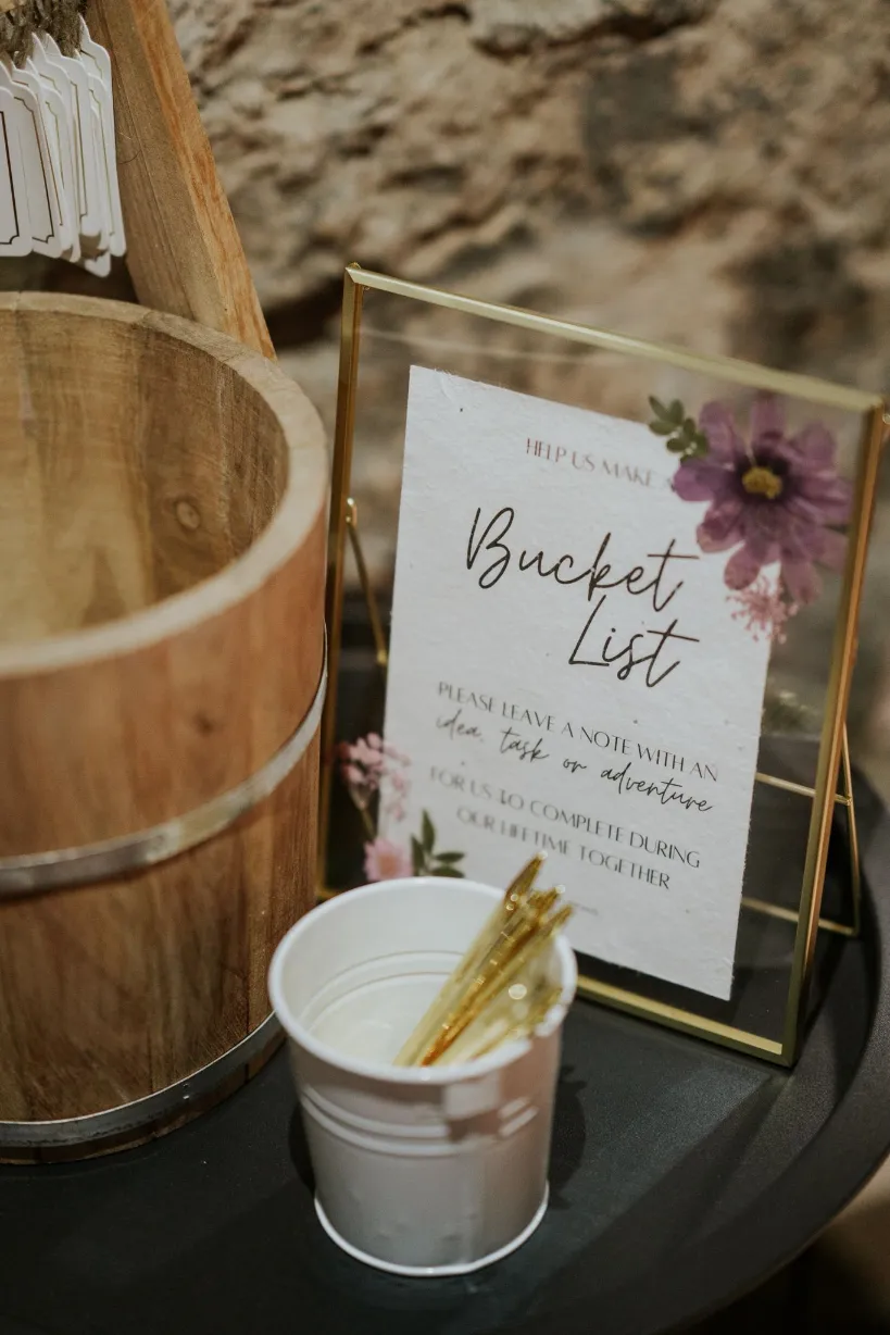 Wooden bucket list wedding advice station